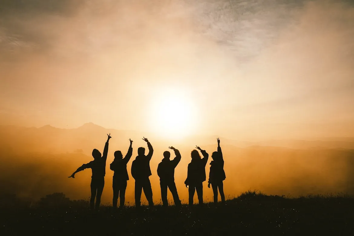 group staring at sunset